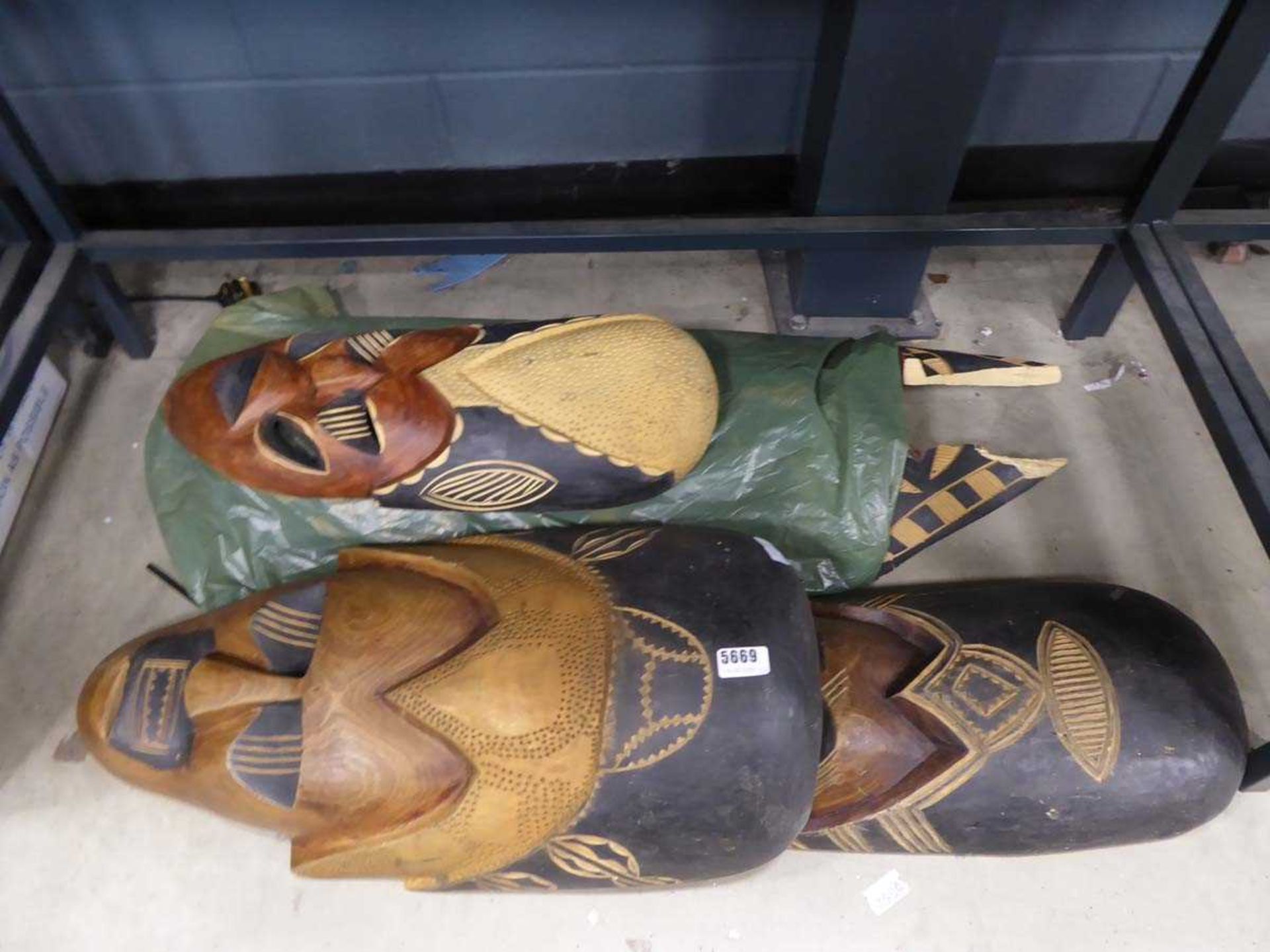 Four large tribal masks