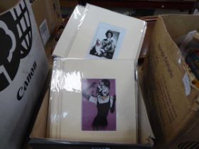 Box of photo's of Banksy's artworks