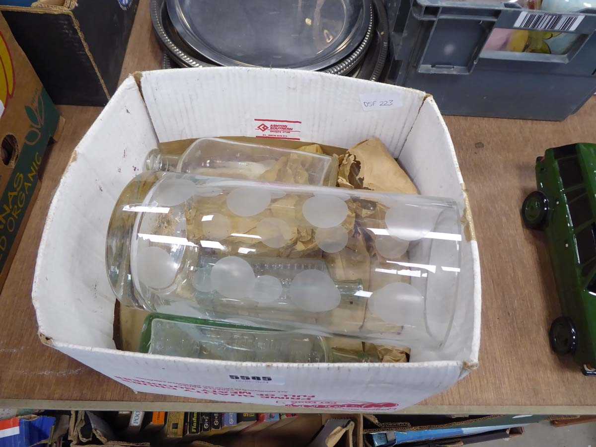 Small box containing glass bottles and glass vases
