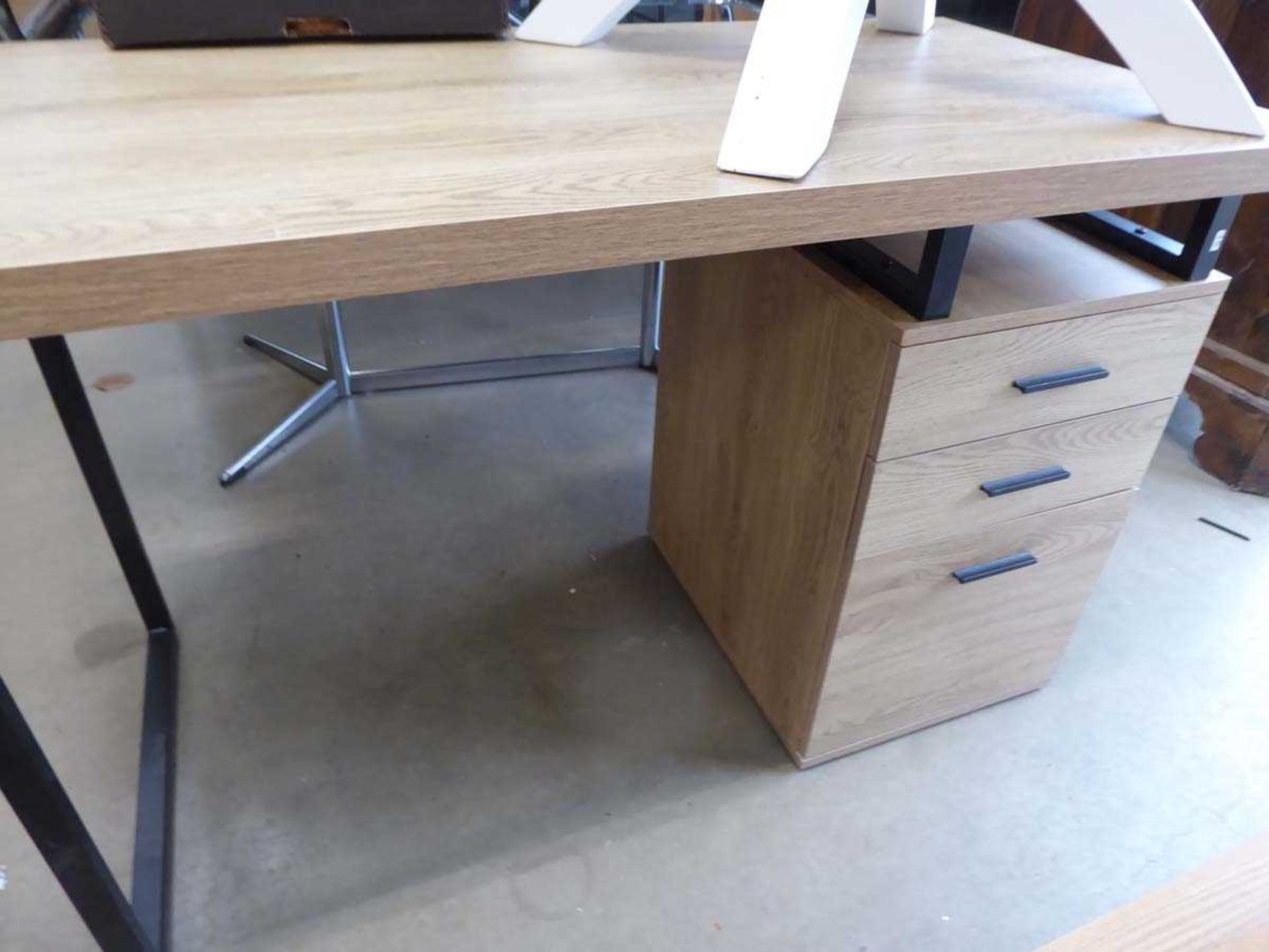 Contemporary design desk with light oak top matching 3 drawer pedestal on black supports