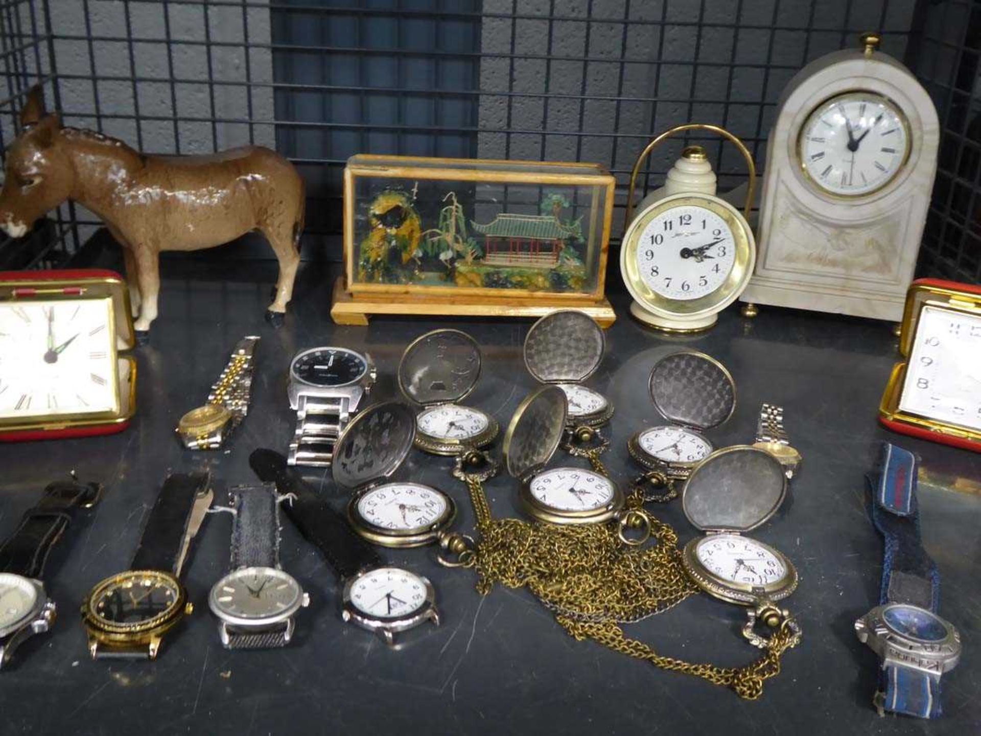 Cage containing Beswick donkey figurine, watches, fob watches and clocks