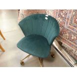 Green shell back chair on 5 star swivel base