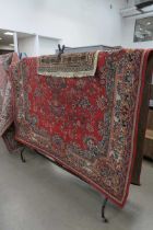 (7) All wool rug with geometric and floral red design