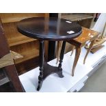 Single circular occasional table with shelf under