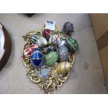 Quantity of collectible egg-shaped trinket boxes and small wall mirror