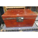 Red stained vintage travel trunk