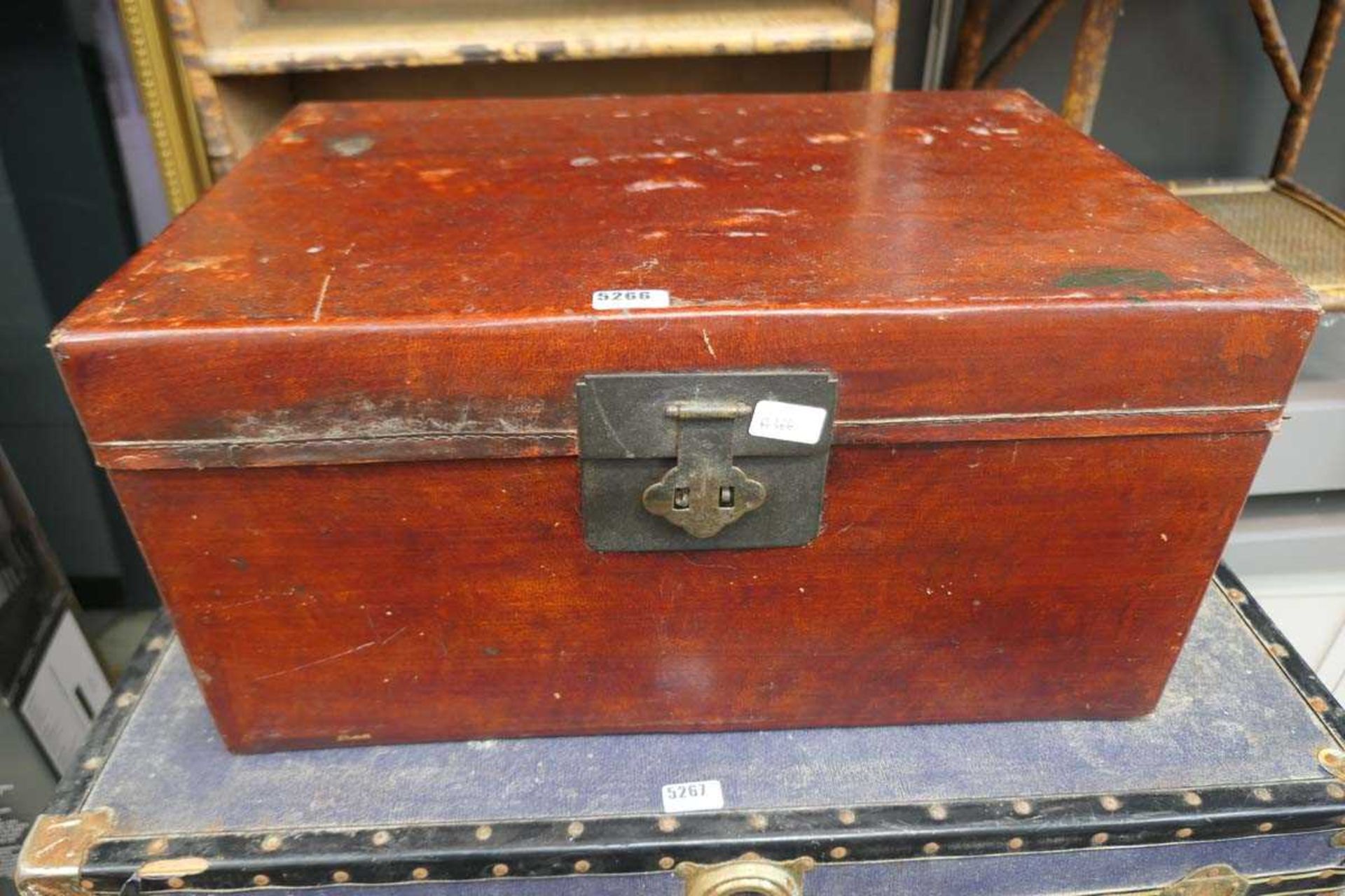 Red stained vintage travel trunk