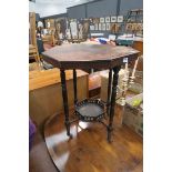 Hexagonal topped occasional table on small tapered supports with shelf under