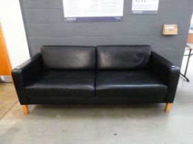 Black 3 seater sofa on wooden supports