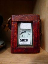 Small carriage clock in leather carry case