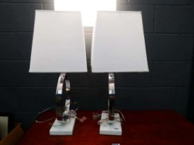 Pair of table lamps on a marble base with white rectangular shades