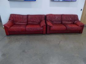 Pair of red leather effect 2 seater sofas