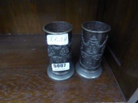 Pair of metal floral patterned Indian vases