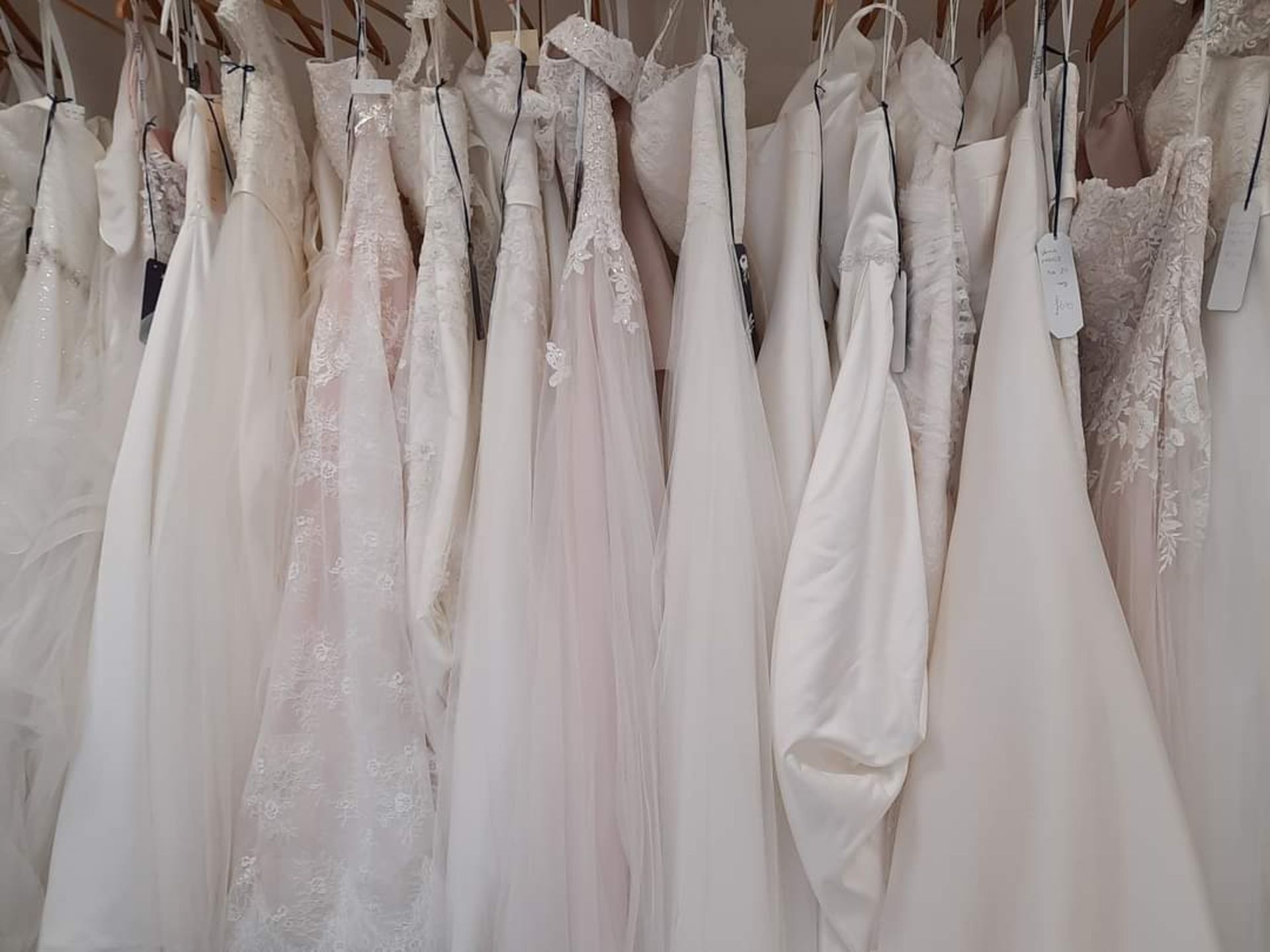 Bulk Lot of 25 Wedding Gowns/Bodices/Skirts All Mixed Sizes and Designs. RRP £25K Etx. Mainly Iv...