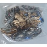 A Collection of Brooches Etc In A Bag. Approximately 254G.