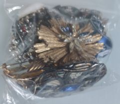 A Collection of Brooches Etc In A Bag. Approximately 254G.