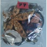 A Collection of Brooches Etc In A Bag. Approximately 227G.