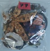 A Collection of Brooches Etc In A Bag. Approximately 227G.