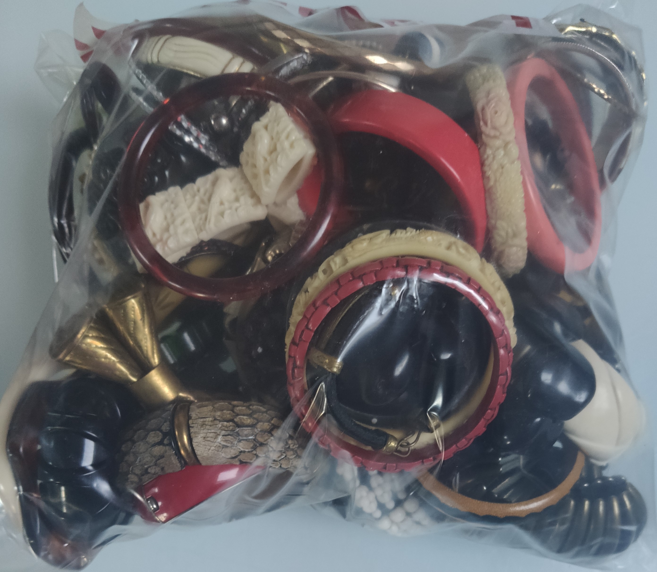 A Large Collection of Bracelets and Bangles In A Bag. Approximately 2KG.