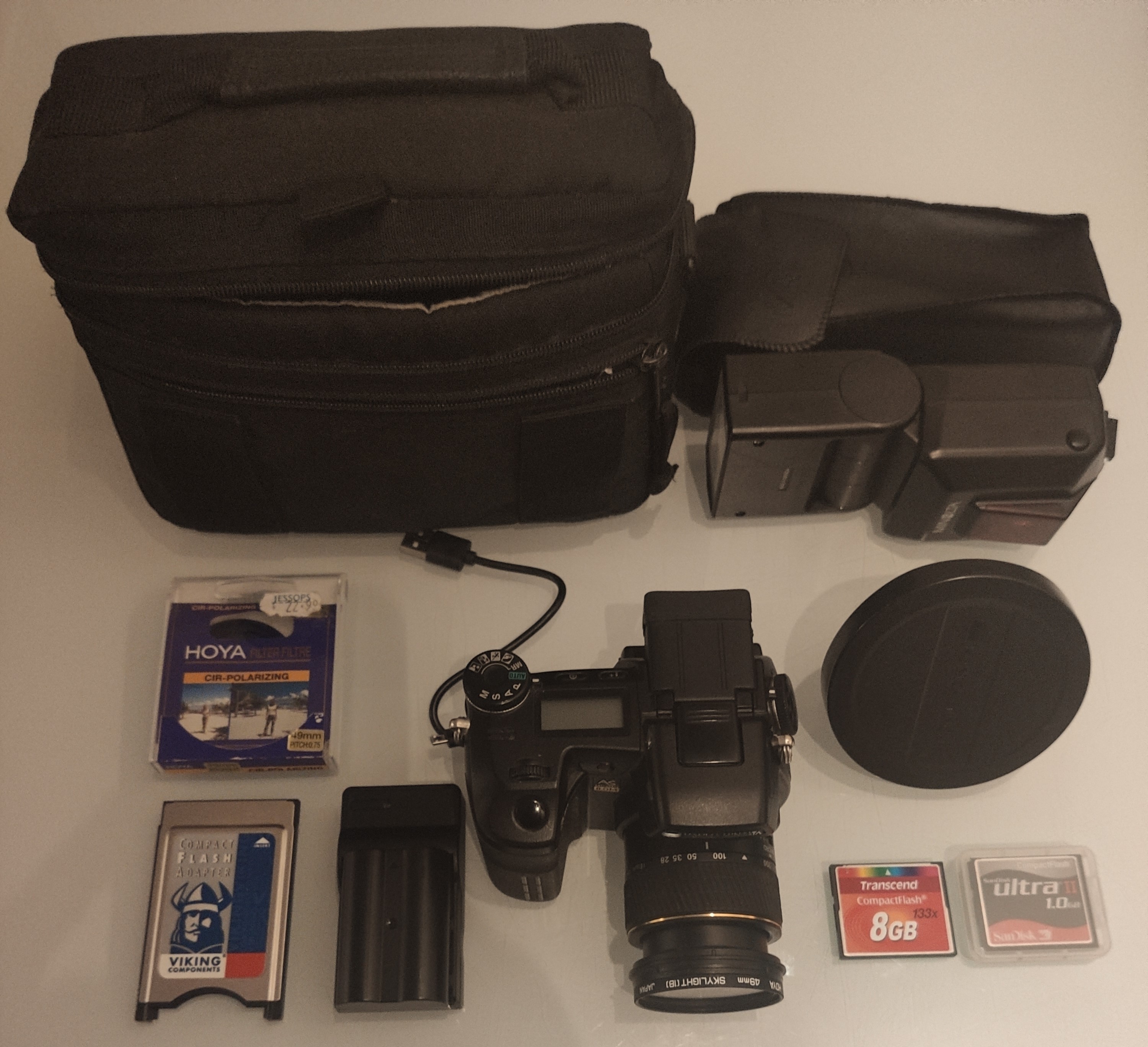 A Konica Minolta Dimage A2 Digital Camera Kit. 2 X Batteries, Wide Lens Converter and More.