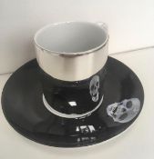 Damian Hurst (B 1965) Electro Silver Plate ‘The Incomplete Truth’ Anamorphic Cup and Saucer 2006