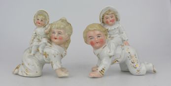 Pair of English Victorian Piano Baby Figurines