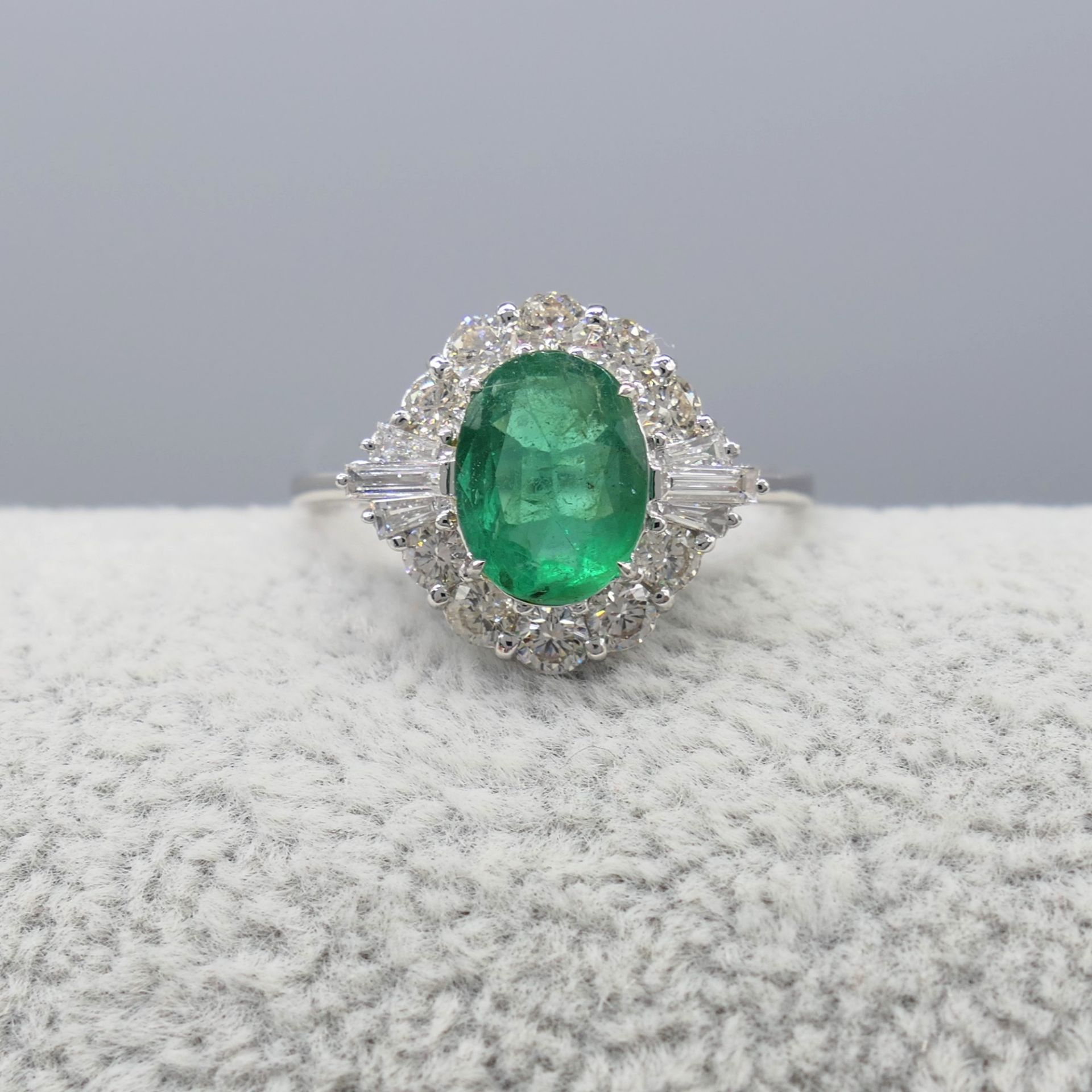 Stylish 1.05 Carat Emerald and Diamond Dress Ring In 18 Carat White Gold