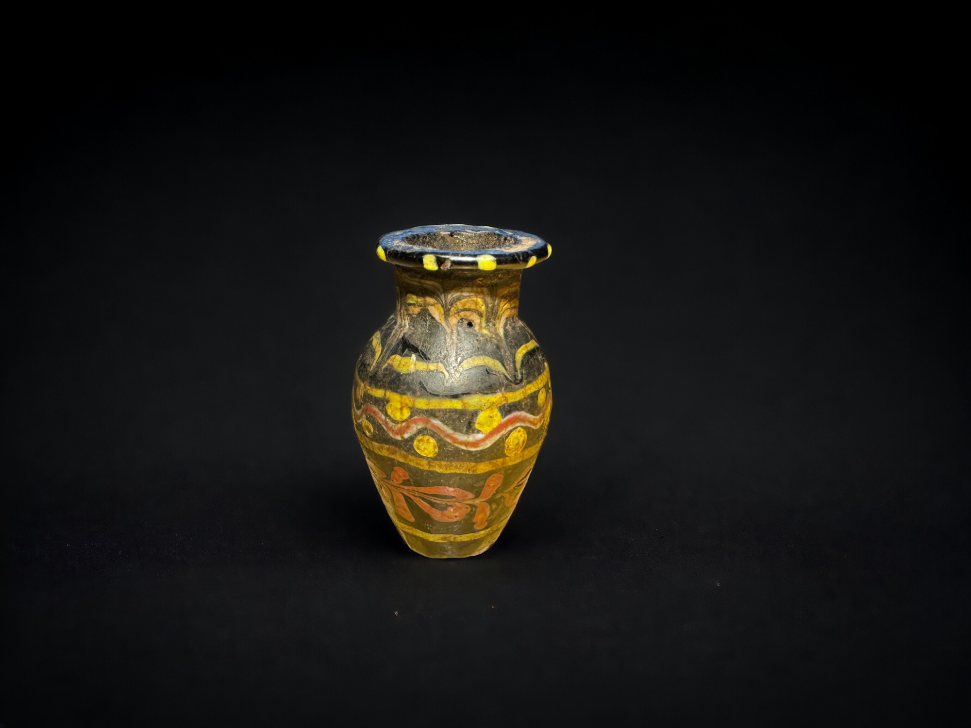 Antiquities: Roman Black, Yellow, and White Glass Bottle