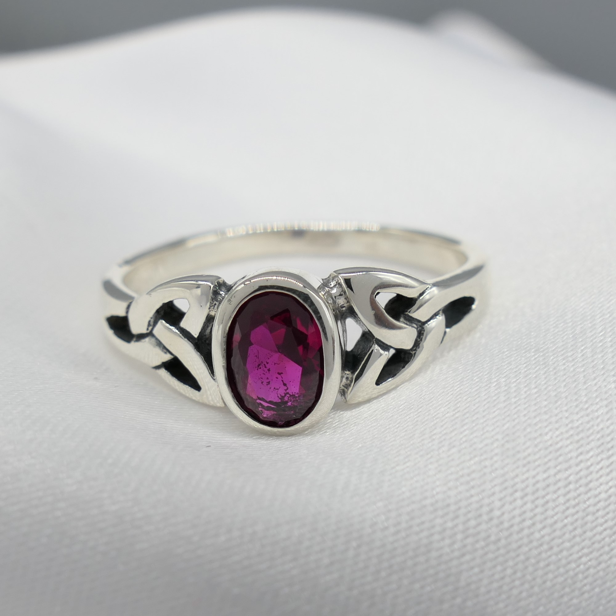 Sterling Silver Celtic-Style Dress Ring Set With An Oval Magenta Cubic Zirconia - Image 5 of 5