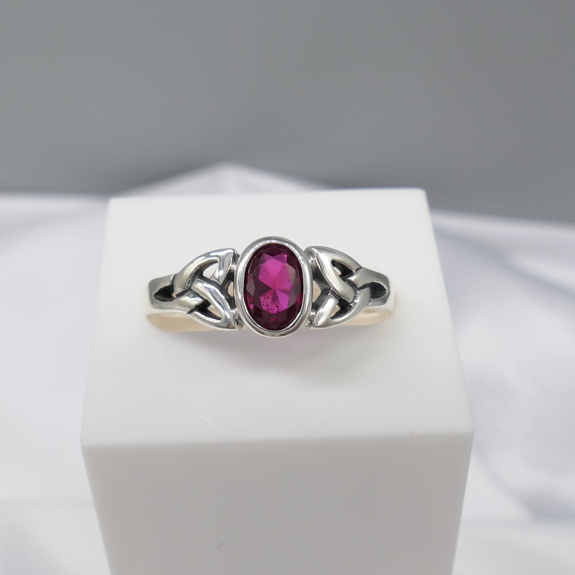 Sterling Silver Celtic-Style Dress Ring Set With An Oval Magenta Cubic Zirconia - Image 4 of 5