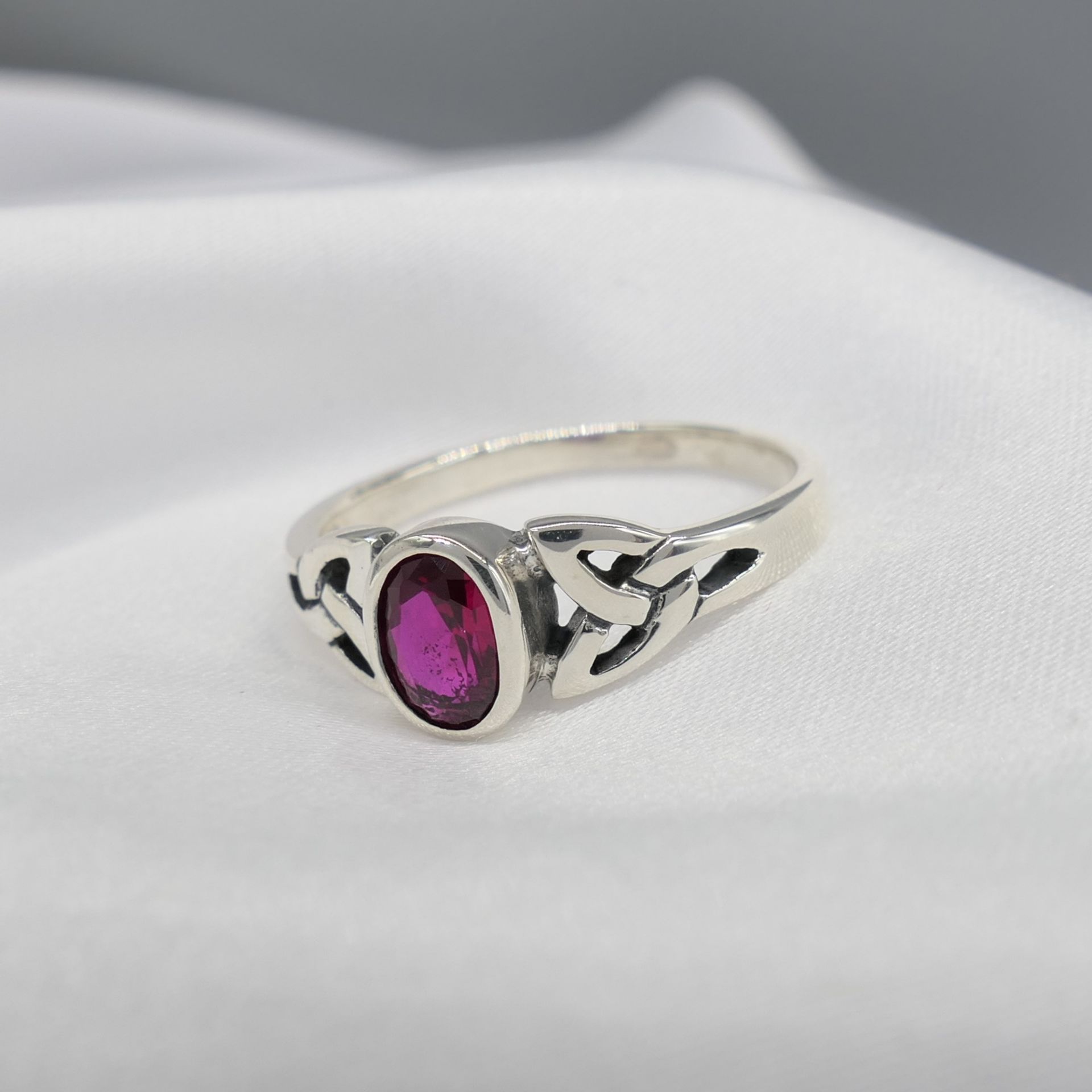 Sterling Silver Celtic-Style Dress Ring Set With An Oval Magenta Cubic Zirconia - Image 2 of 5