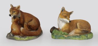 Pair of English Hand Painted Ceramic Fox Sculptures