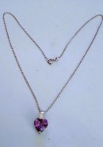 A Silver & Heart Shaped Amethyst Pendant On Chain With Valuation