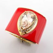 A Luxurious Gold Ring Featuring Orange Laser Enamel, Elegantly Adorned With Vibrant Morganite and...