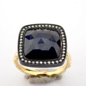 An Exquisite Gold Ring Detailed With Slice Cut Rough Sapphire In The Centre and Brilliant Diamond...