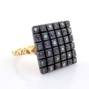 An Exquisite Ring Detailed With Pink Sapphires, Brilliant Diamonds and Gold On Silver.