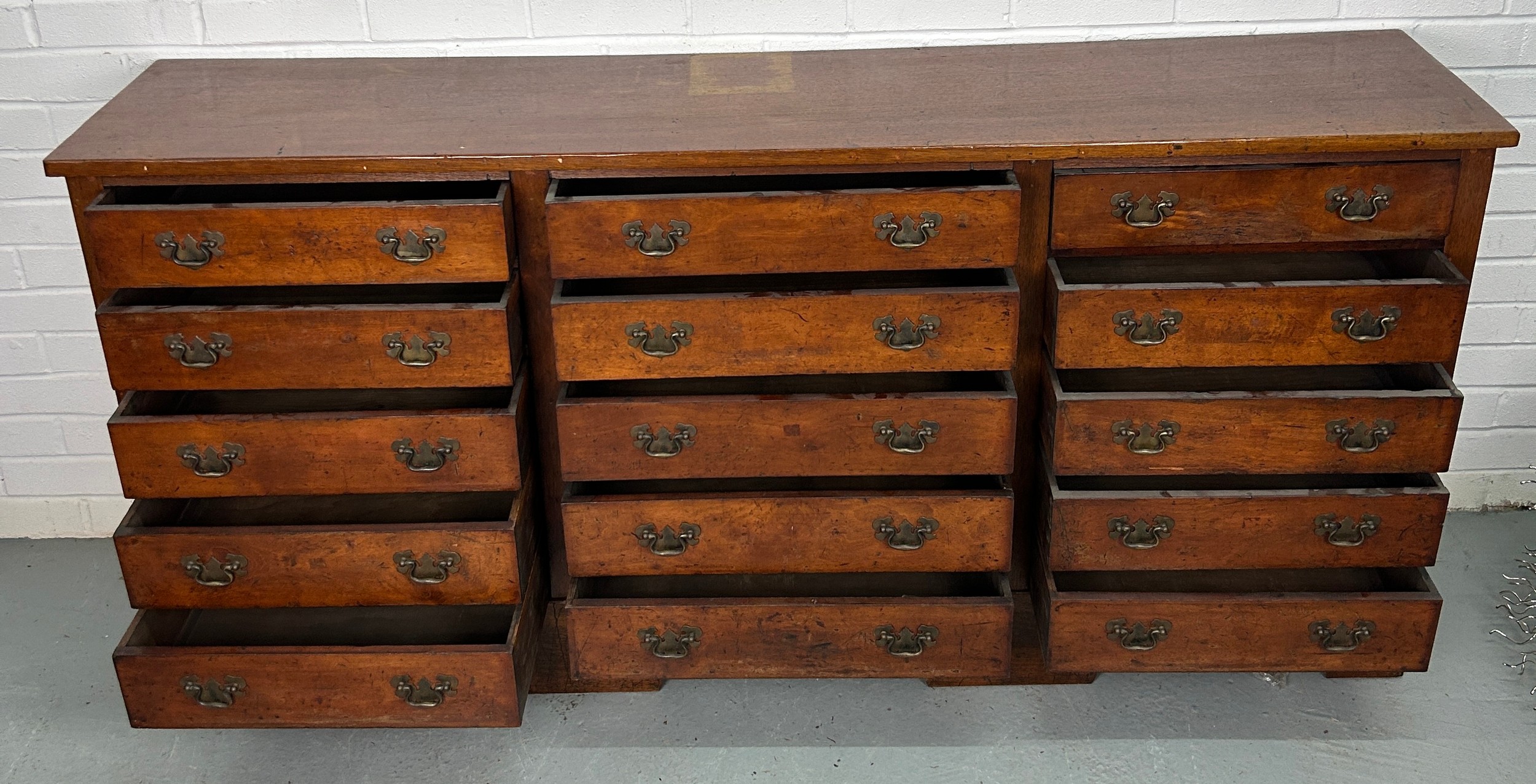 A 19TH CENTURY BANK OF FIFTEEN DRAWERS, 170cm x 81cm x 38cm Each drawer with two brass bat wing - Image 10 of 11