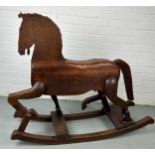 A 19TH CENTURY ROCKING HORSE FROM NUREMBERG IN GERMANY, Primitively carved, the horse having bent