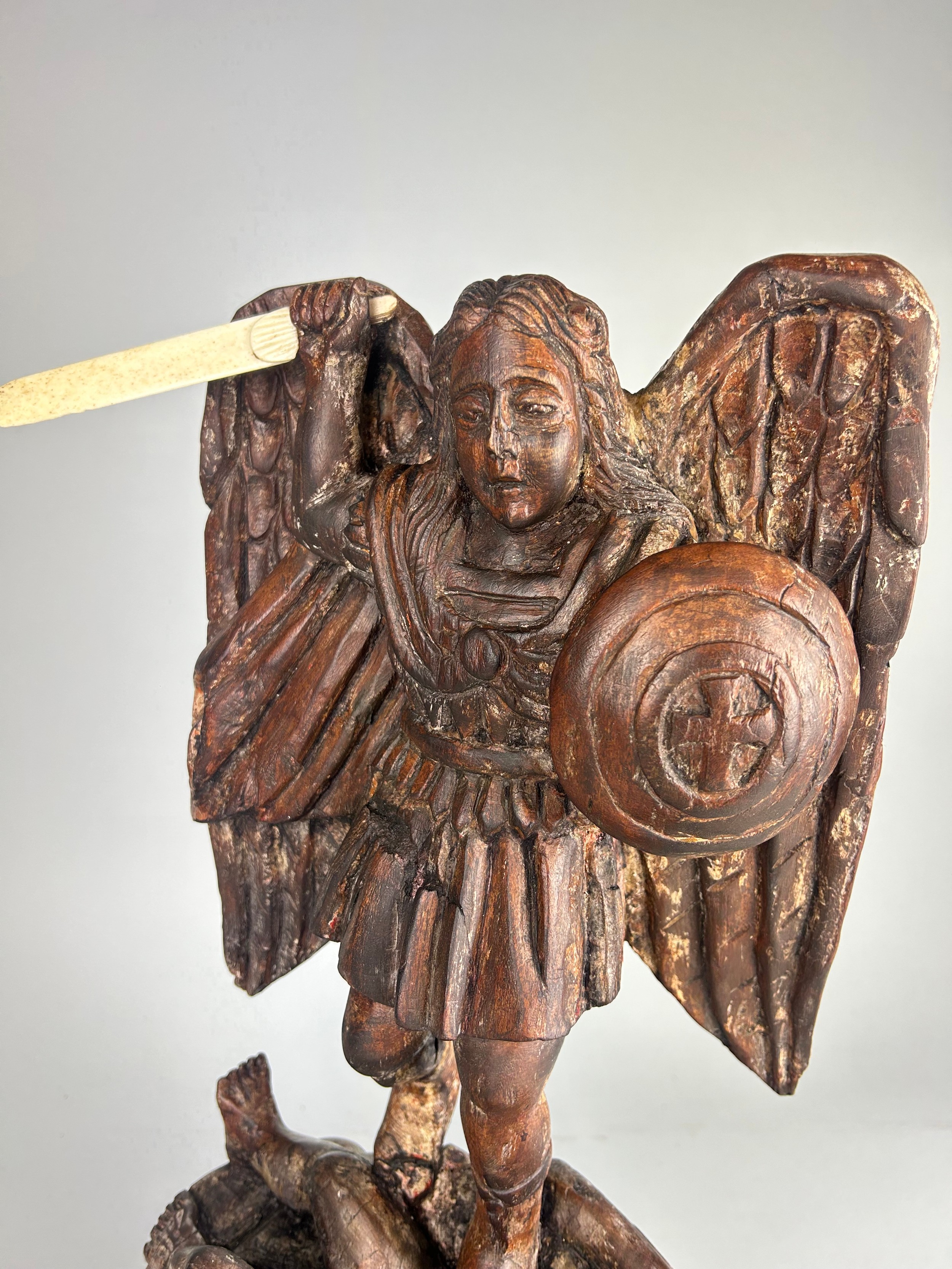 A OAK CARVED FIGURE OF ST MICHAEL SLAYING THE DEVIL, With bone sword and horns. Probably 19th - Image 2 of 5