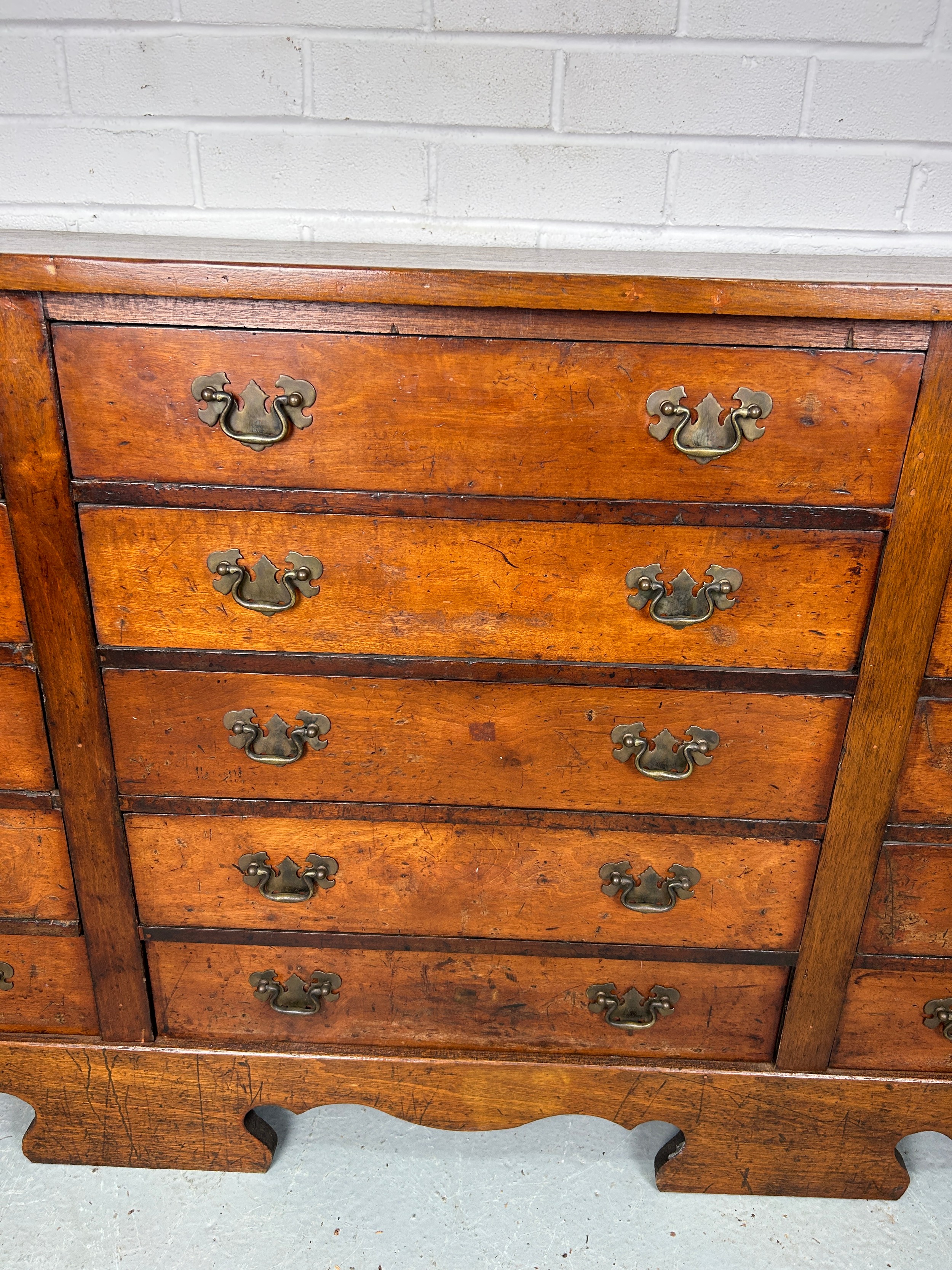 A 19TH CENTURY BANK OF FIFTEEN DRAWERS, 170cm x 81cm x 38cm Each drawer with two brass bat wing - Image 3 of 11