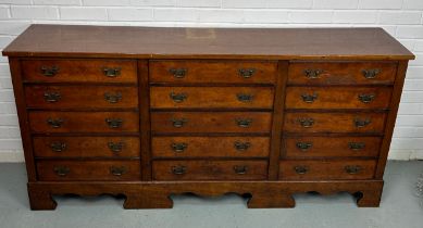 A 19TH CENTURY BANK OF FIFTEEN DRAWERS, 170cm x 81cm x 38cm Each drawer with two brass bat wing