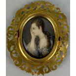 A 19TH CENTURY PORTRAIT MINIATURE ON IVORY OF A LADY WITH A PEARL NECKLACE AND HEAD WEAR, Signed