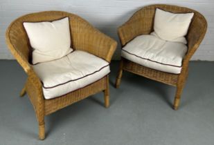 A PAIR OF BAMBOO / CANE ARMCHAIRS (2), Each with white cushion seat. 75cm x 70cm x 65cm each.