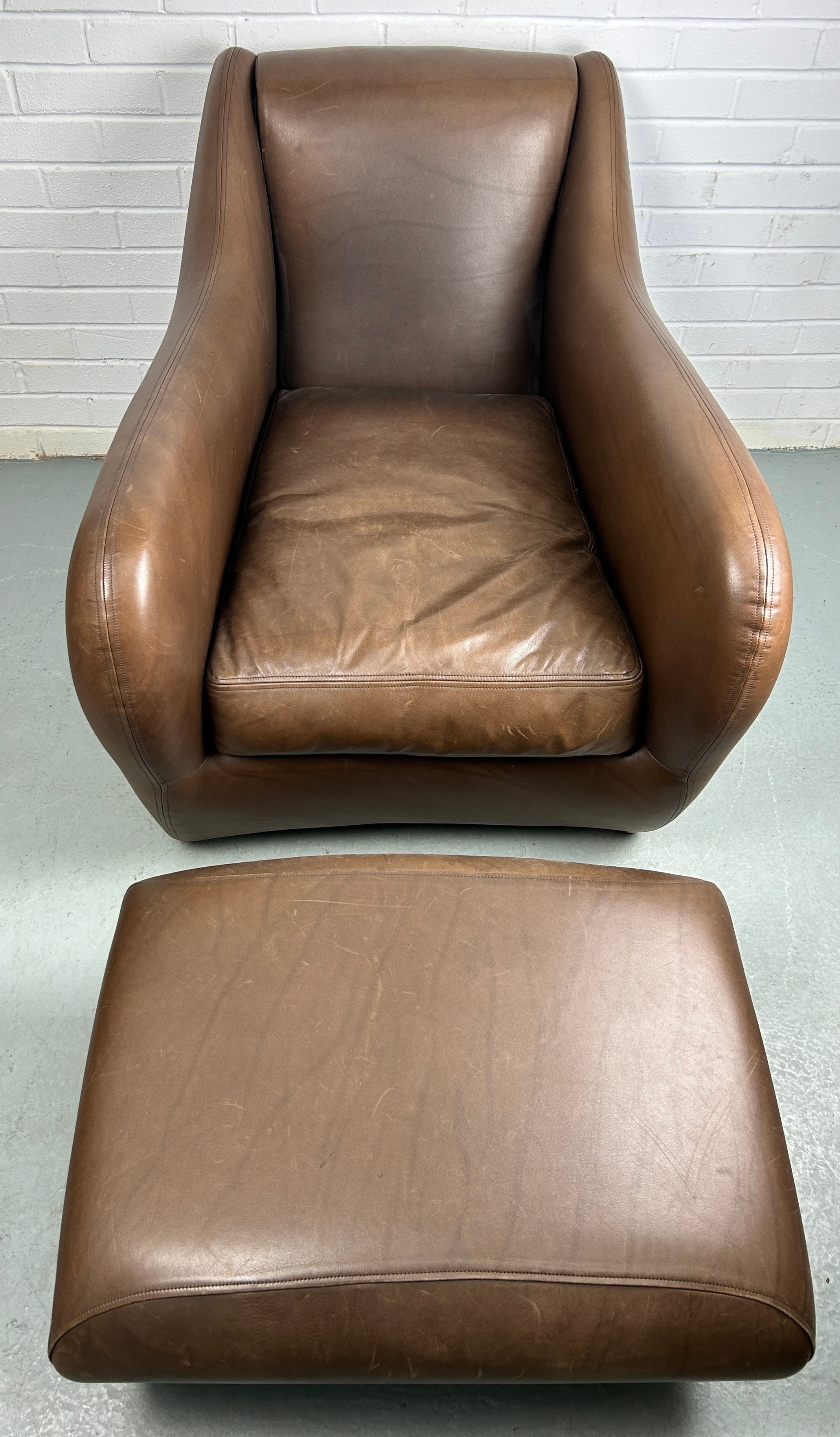 AN SCP BALZAC BROWN LEATHER ARMCHAIR AND FOOTSTOOL BY MATTHEW HILTON, Retailed by the Conran Shop. - Image 2 of 6