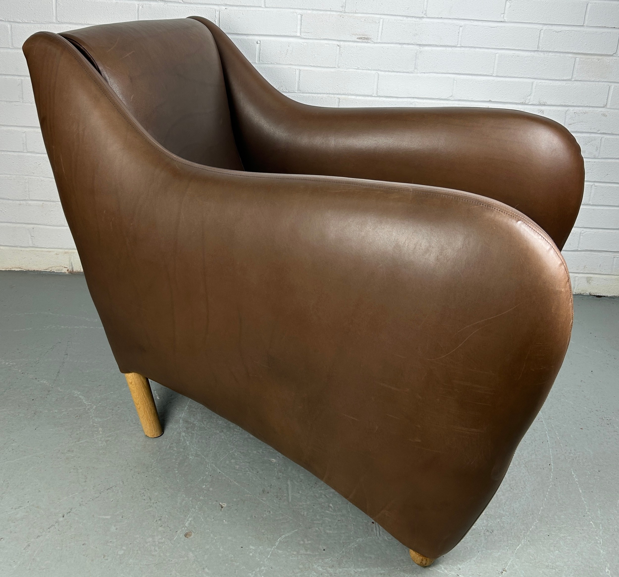 AN SCP BALZAC BROWN LEATHER ARMCHAIR AND FOOTSTOOL BY MATTHEW HILTON, Retailed by the Conran Shop. - Image 5 of 6