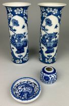 A PAIR OF CHINESE KANGXI STYLE SLEEVE VASES WITH PRUNUS FLOWERS AND PAINTED PANELS, The vases 26cm H