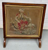 A 19TH CENTURY FIRE SCREEN WITH NEEDLEPOINT DEPICTION OF A YOUNG GENTLEMAN WEARING A TURBAN WITH A