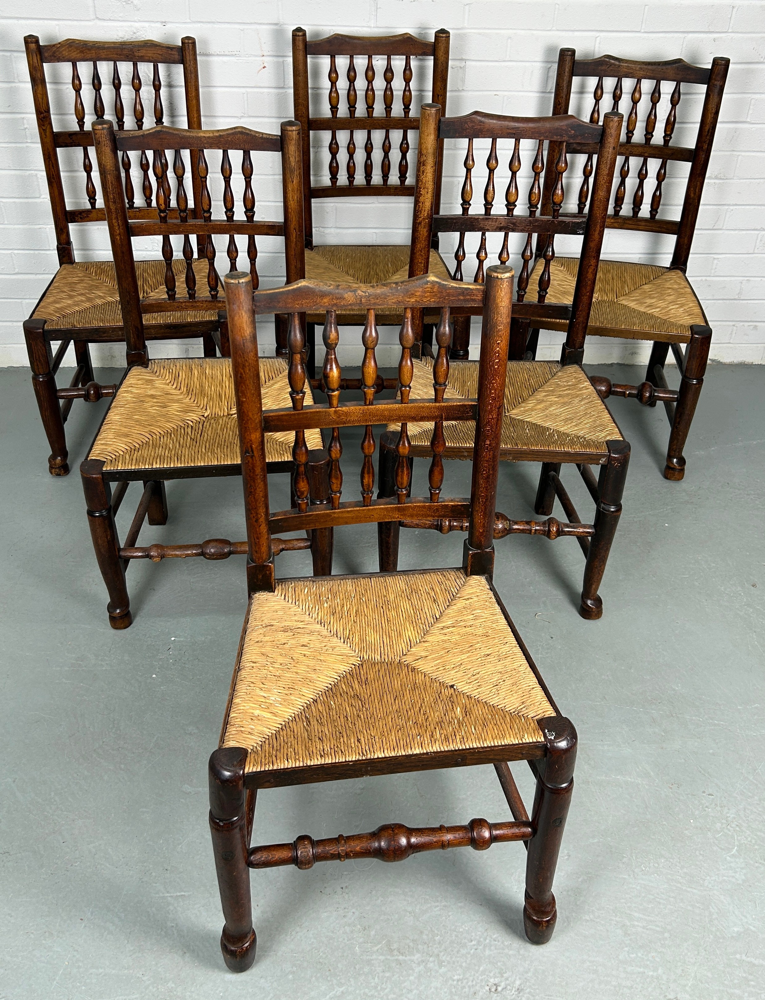 A SET OF EIGHT COUNTRY HOUSE BOBBIN SPINDLE BACK CHAIRS WITH RUSH SEATS PROBABLY NORTH COUNTRY, Late - Image 2 of 8