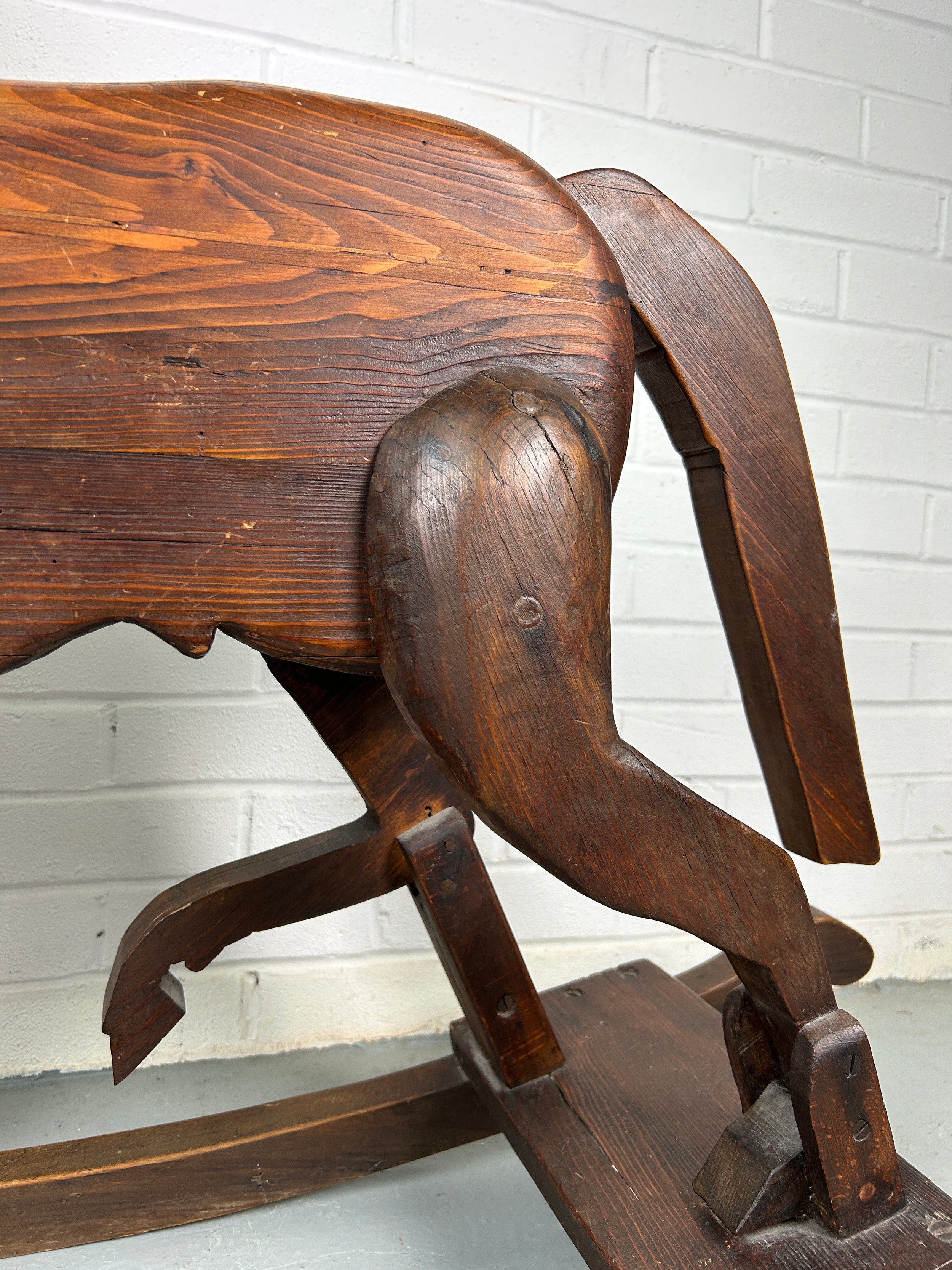 A 19TH CENTURY ROCKING HORSE FROM NUREMBERG IN GERMANY, Primitively carved, the horse having bent - Image 4 of 9