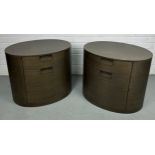 A PAIR OF BROWN OVAL WOODEN BEDSIDE CABINETS BY MAXALTO, Each with two sliding compression